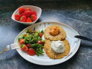 Vegetable Pancakes with Herb Quark, Hummus, and Mixed Green Salad